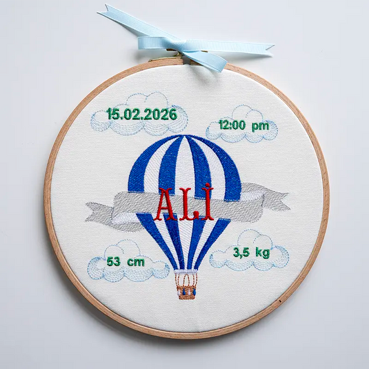 Customized baby boy name hoop with blue hot air balloon embroidery for a newborn gift