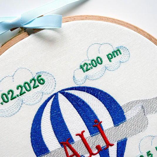 Customized baby boy name hoop with blue hot air balloon embroidery for a newborn gift